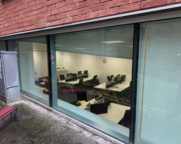 Commercial office glazing in Glasgow after restoration of acid-etched graffiti