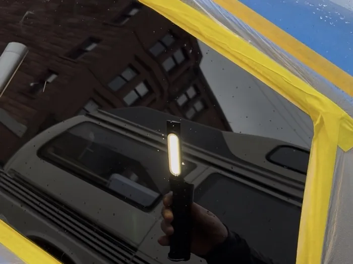 Same car window glass after restoration, clear with no visible scratches